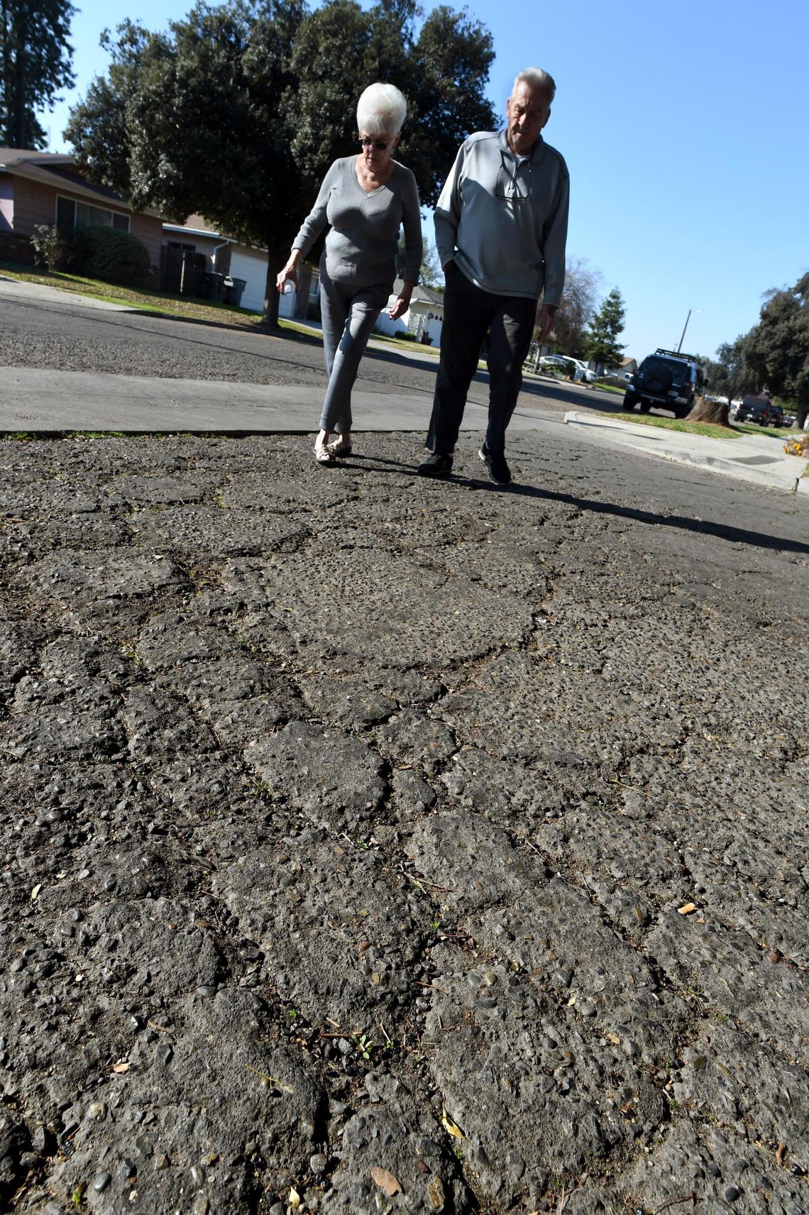 BEFORE: Donna and Bob Krum, who have lived in the same house since 1968 on East Cambridge Avenue, near Chestnut Avenue, walk in their neighborhood in 2020.