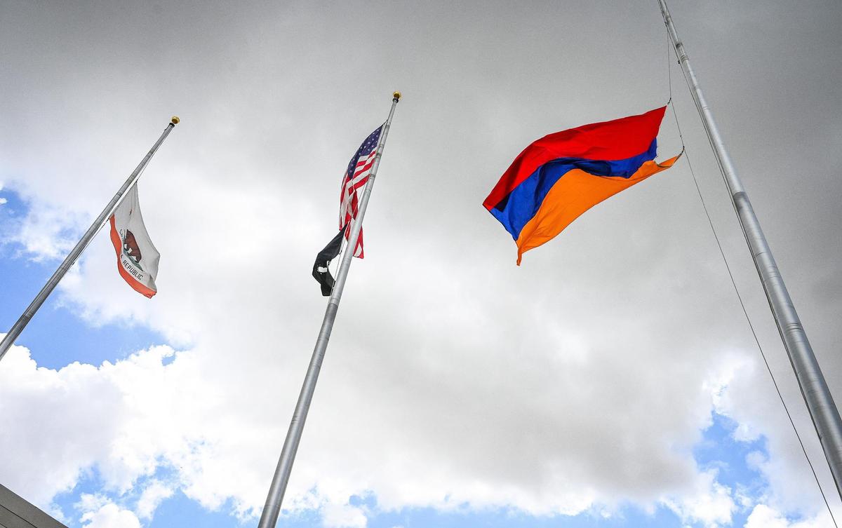 The Armenian flag flies above Fresno City Hall during the annual Armenian genocide commemoration and flag raising ceremony on Friday, April 22, 2022.