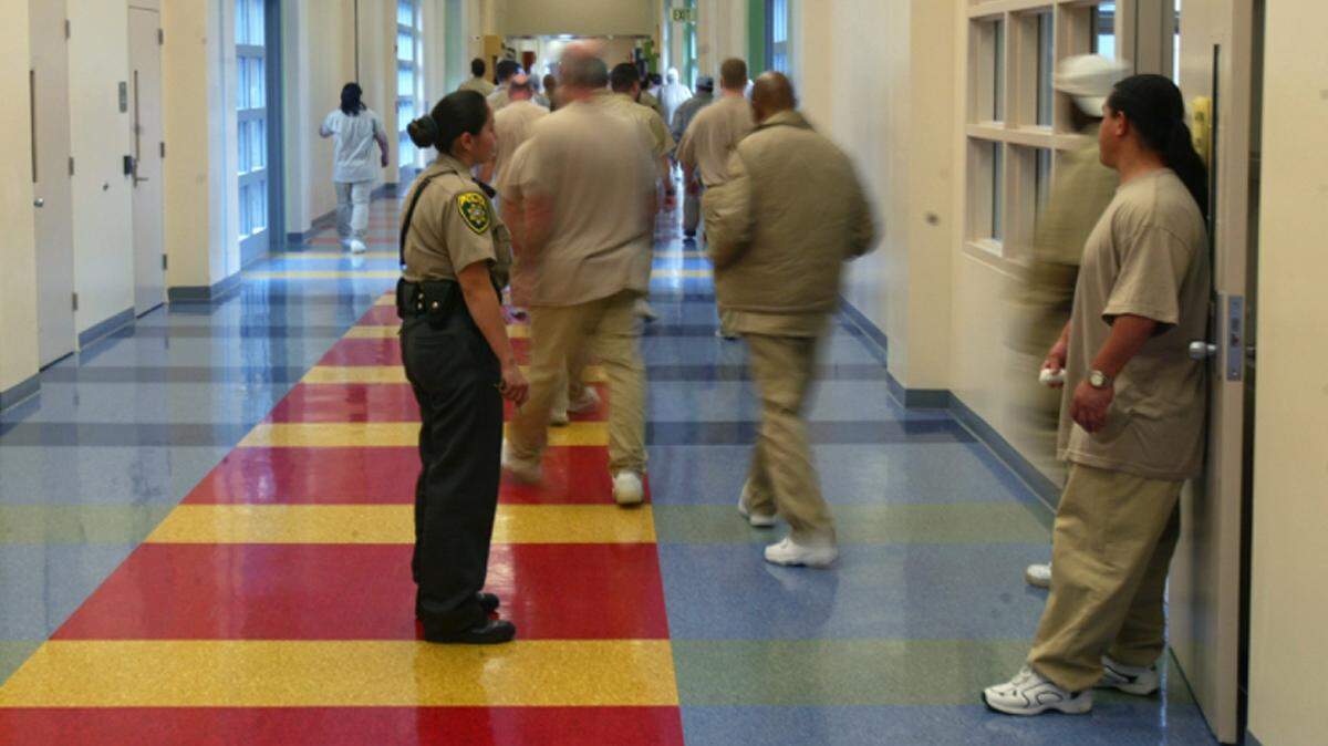 Patients leave the cafeteria at Coalinga State Hospital.  The hospital was built in 2005 for sexually violent predators who have served jail time, but have mental disorders that keep them from being released back into society until they complete a therapy program.