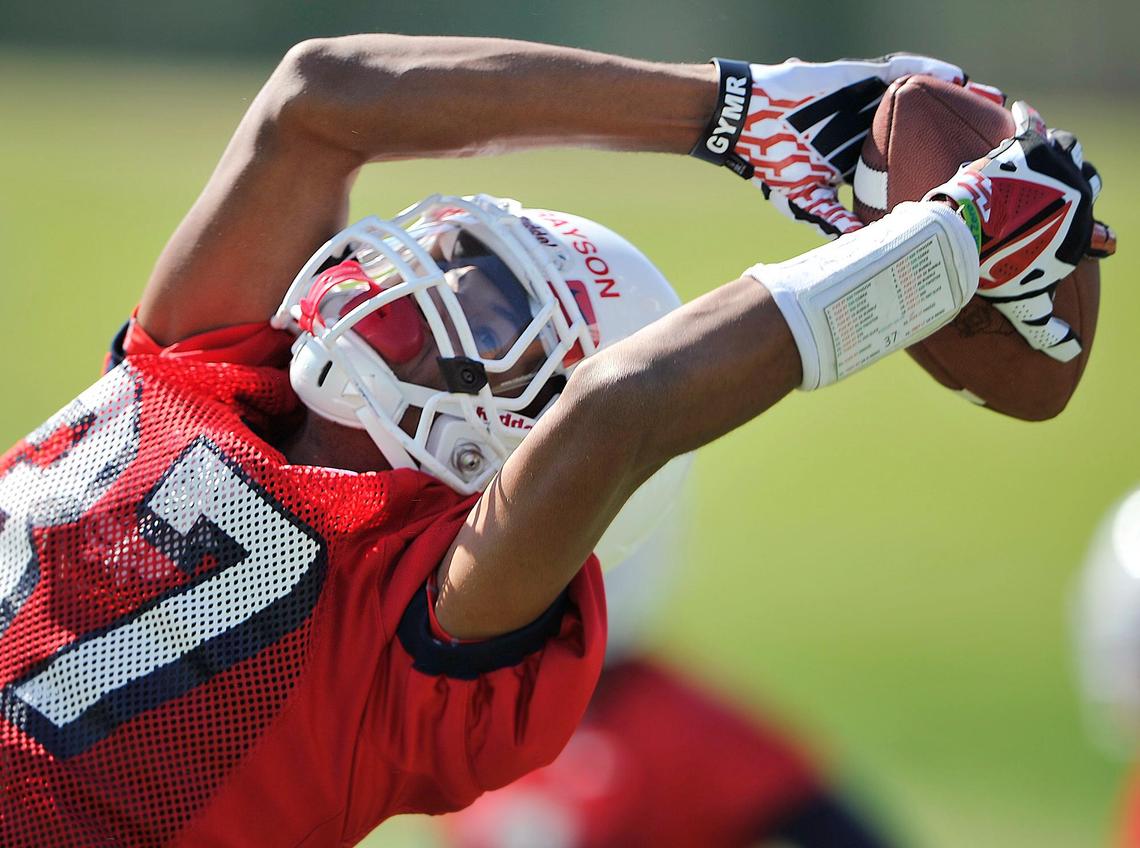 Fresno State wide receiver Anthony Grayson makes a reception during his first fall camp with the Bulldogs, Saturday, Aug. 2, 2014 in Fresno..