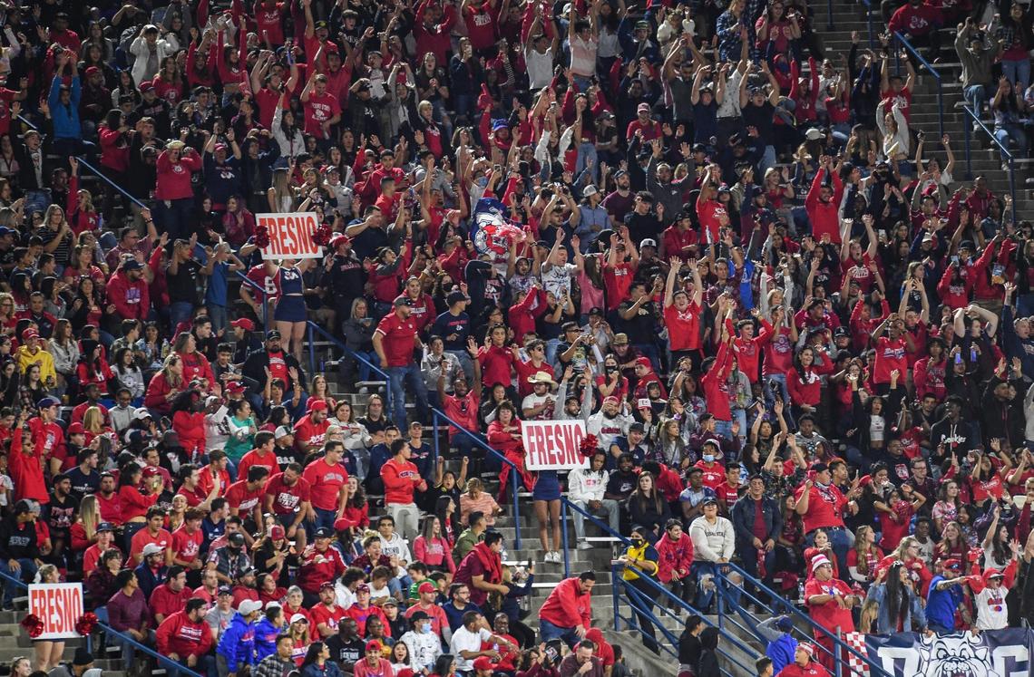 Fresno State fans cheer while doing the wave during the Bulldogs game against Nevada at Bulldog Stadium on Saturday, Oct. 23, 2021.