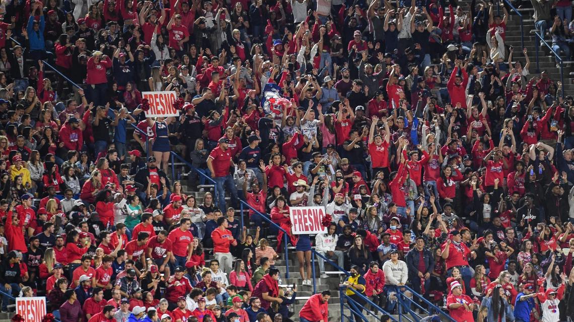 Fresno State fans cheer while doing the wave during the Bulldogs game against Nevada at Bulldog Stadium on Saturday, Oct. 23, 2021.