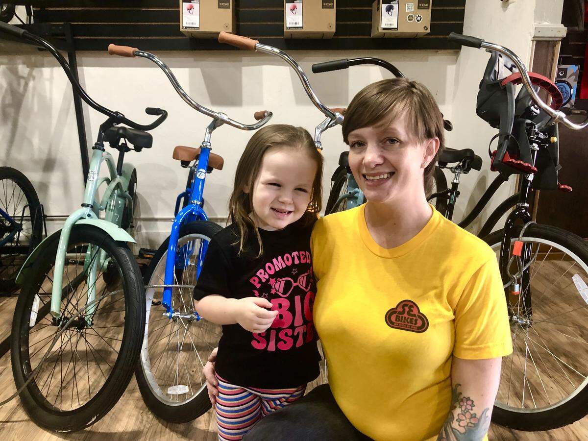New family-owned Awesome Bike Company in Old Town Clovis offers bikes, repairs and cycling education, run by longtime cyclists Ashley and Tommy Merriott. 3-year-old daughter Penelope (left) also helps around the shop.