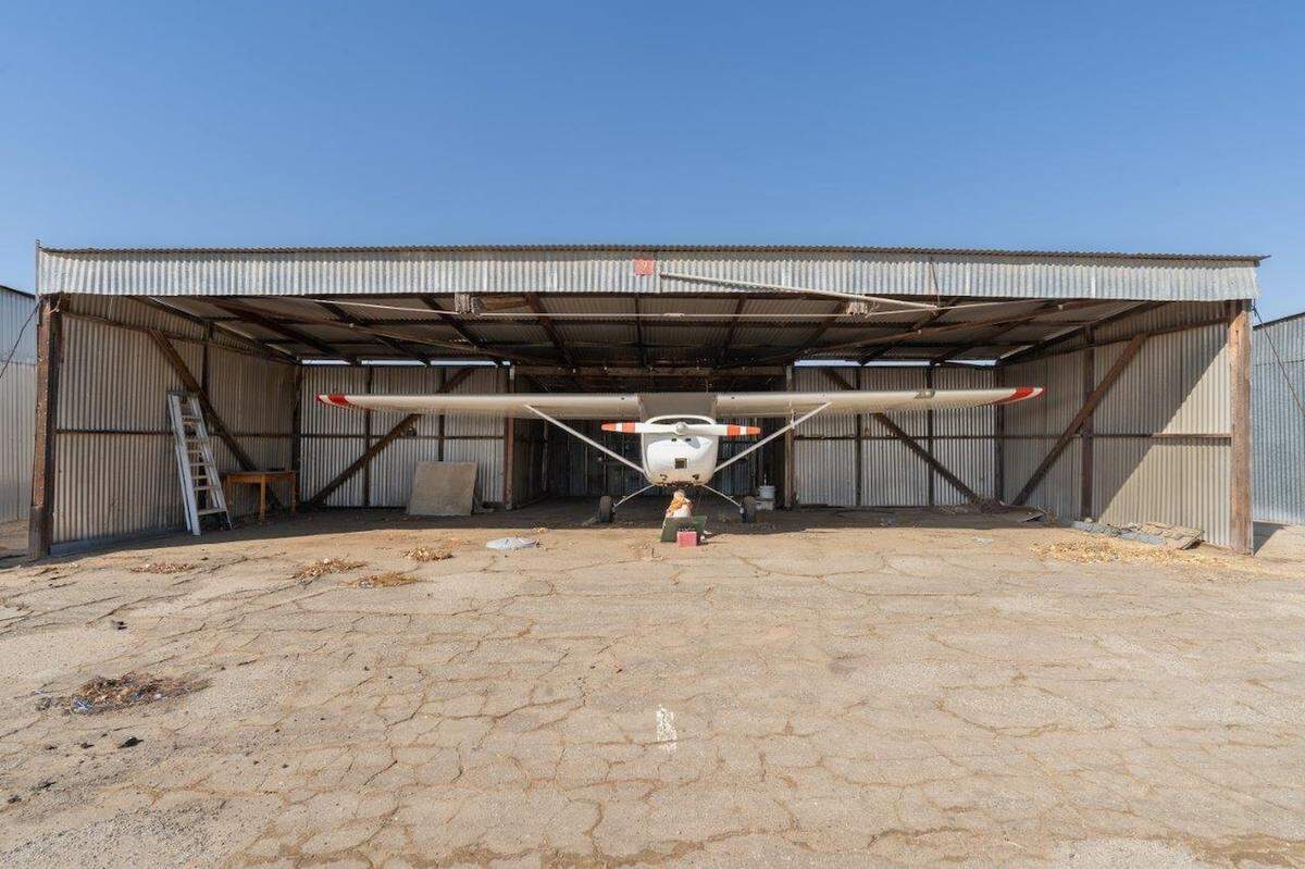 Eckert Field, a small airport facility in the small South Valley town of Strathmore, is for sale for $1.275 million. The airport is still active and can be used by the public. Six of the 20 hangars are currently leased.