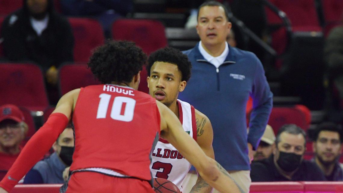 Fresno State coach Justin Hutson watches as point guard Isaiah Hill matches up with with New Mexico’s Jaelen House Monday, Feb. 28, 2022 in Fresno.