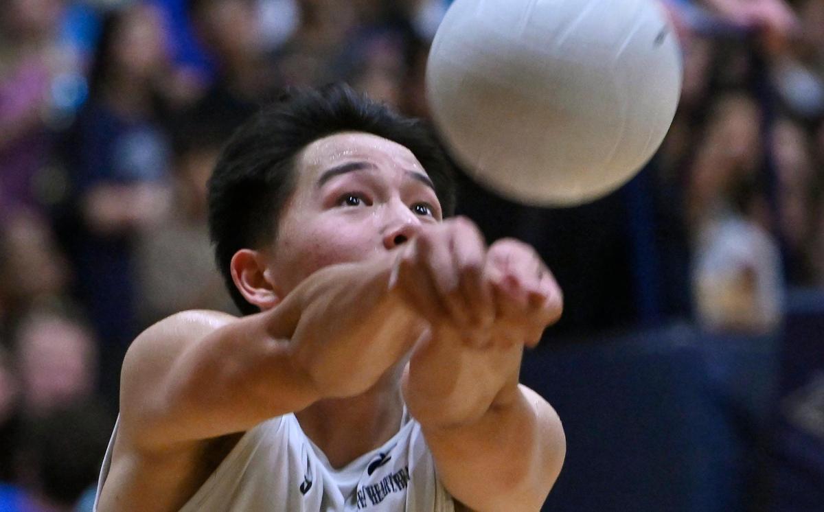 Clovis East’s Tristan Moua keeps the ball in play against Clovis High in the Central Section Division I Volleyball Championship Thursday, May 11, 2023 in Clovis.