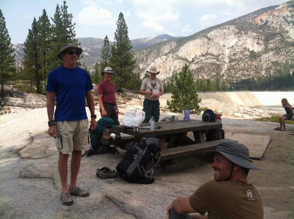 Nicholas Torchia, front right, with his uncles and a friend at the beginning of their July 2021 backpack trip, waiting for a ferry across Florence Lake.