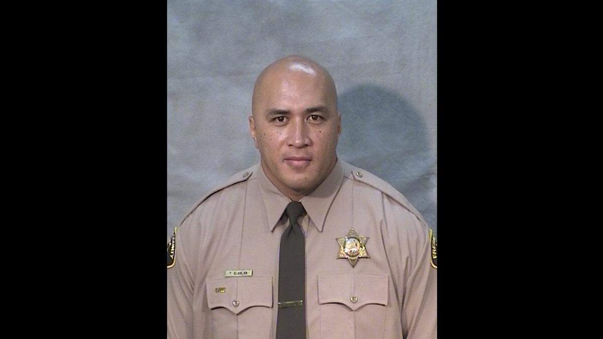 Fresno County Sheriff’s officer Toamalama Scanlan died Oct. 12, 2021, succumbing to injuries five years after he and another officer, Juanita Davila, were shot by Thong Vang inside the lobby of the main Fresno County Jail in September 2016.