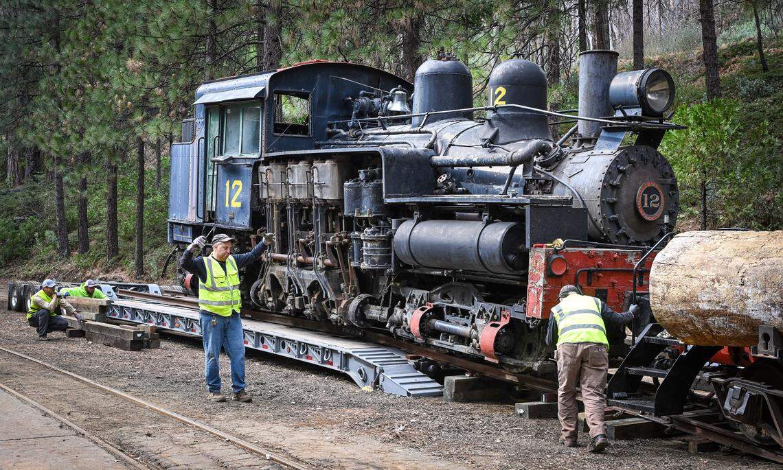 Yosemite Mountain Sugar Pine Railroad staff members work to pull the narrow gage Shay #12 engine onto their tracks after arriving at the railroad in Fish Camp from Colorado on Monday, February. 9, 2026.