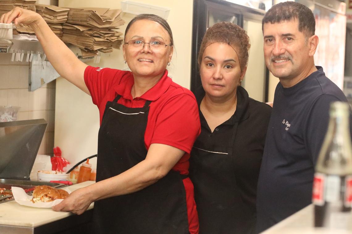 The 56-year-old Abelardo Arenas (right), runs La Elegante Taqueria restaurant with his wife Adela (left), located at 1423 Kern St., Fresno’s Chinatown. The restaurant is open Tuesday to Saturday from 10 a.m. to 2 p.m. Pictured too is Lety Landeros, (center) who has worked at the restaurant for more than 20 years.