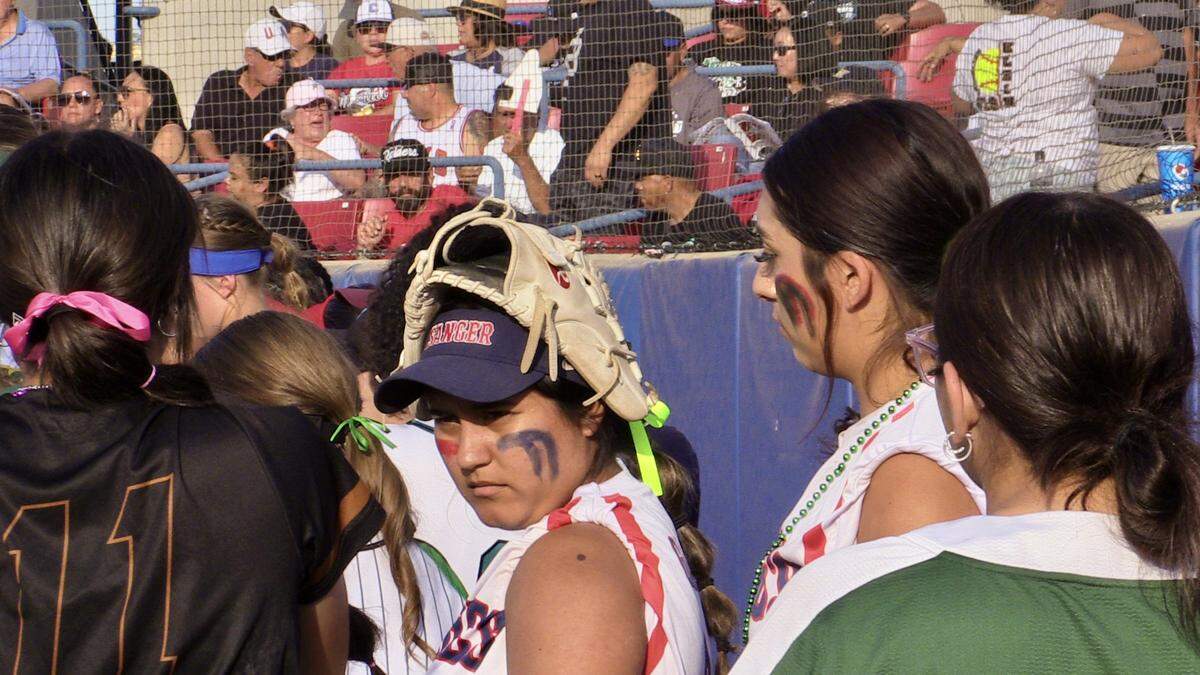 The County’s Anaya Garcia of Sanger, middle, before the City/County All-Star high school softball game on Wednesday, June 21, 2023.