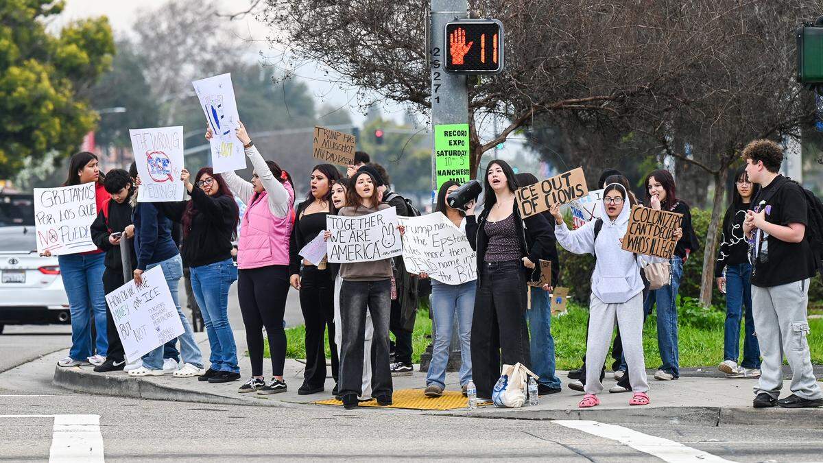 Students from Clovis Unified schools hold signs while protesting ICE enforcement on the corner of Shaw and Clovis avenues on Tuesday, Feb. 10, 2026. Several hundred students from area high schools and even Clark Intermediate were expected to attend the protest throughout the day. 