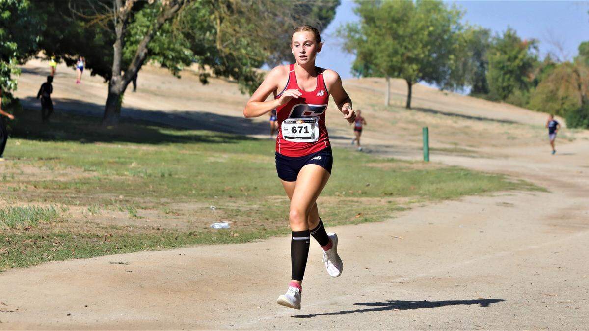 Sanger High sophomore Kinsley Allan took first in the large school varsity girls race at the 20th Golden Eagle Invitational at Woodward Park in Fresno. Her time was 19:57.82.