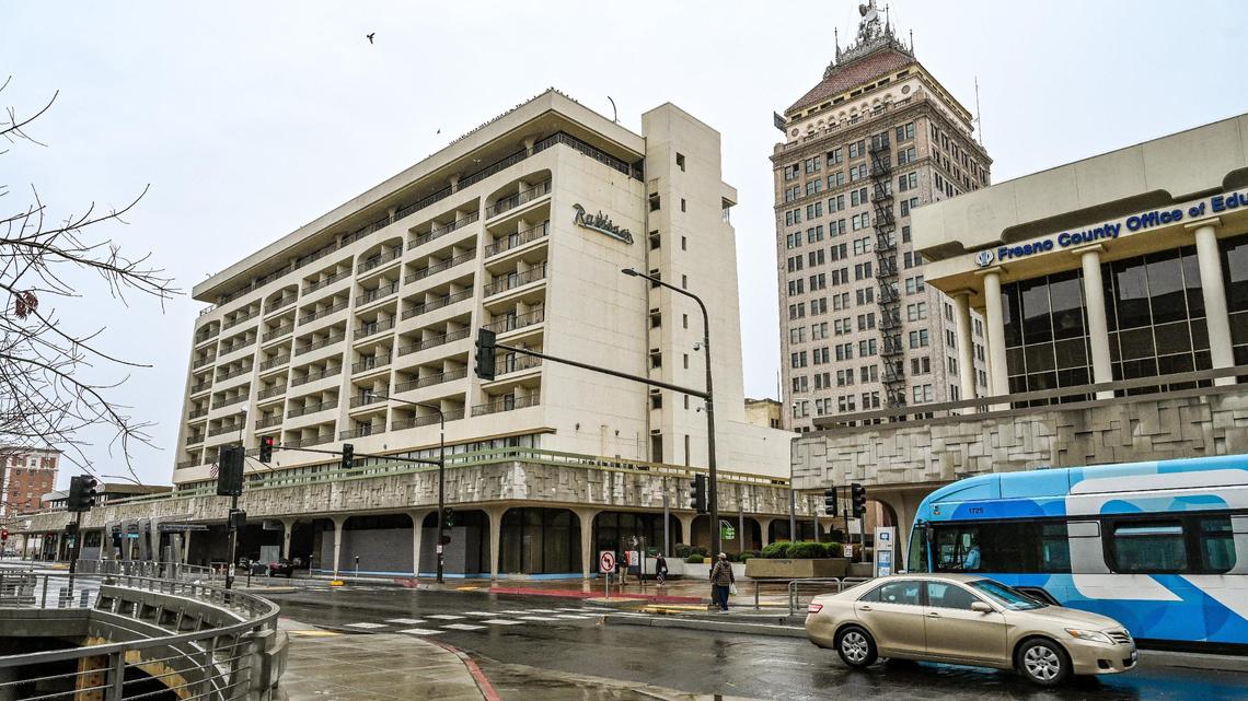 The Radisson Hotel building as seen near the former Club One Casino and the Pacific Southwest Building on Van Ness Avenue in downtown Fresno on Thursday, Dec. 29, 2022. The City of Fresno shut down the popular hotel on Wednesday due to fire code violations.