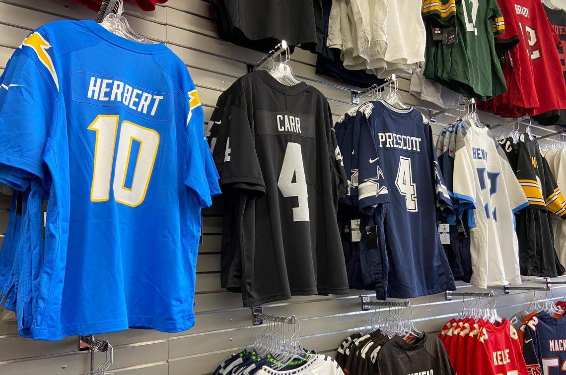 Jerseys like these are for sale at the newly opened Pro Image Sports in River Park.