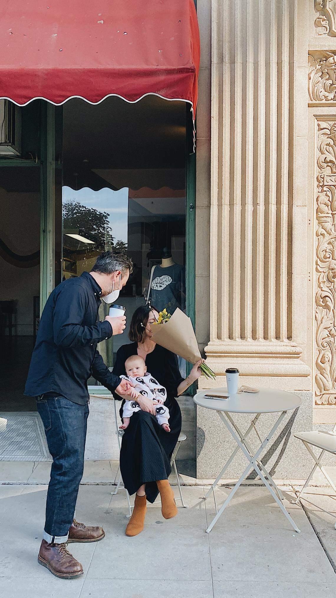 Kirk and Cassey James, with their son Otis, outside their store at the Warnors Theater Complex in downtown Fresno.