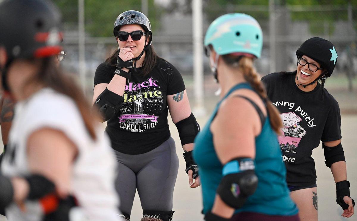 Rebecca “Memento Maureen” Noel, left, laughs as she leads the Ash City Roller Derby team during a practice at Cary Park on Thursday, May 6, 2025, in Fresno, California.