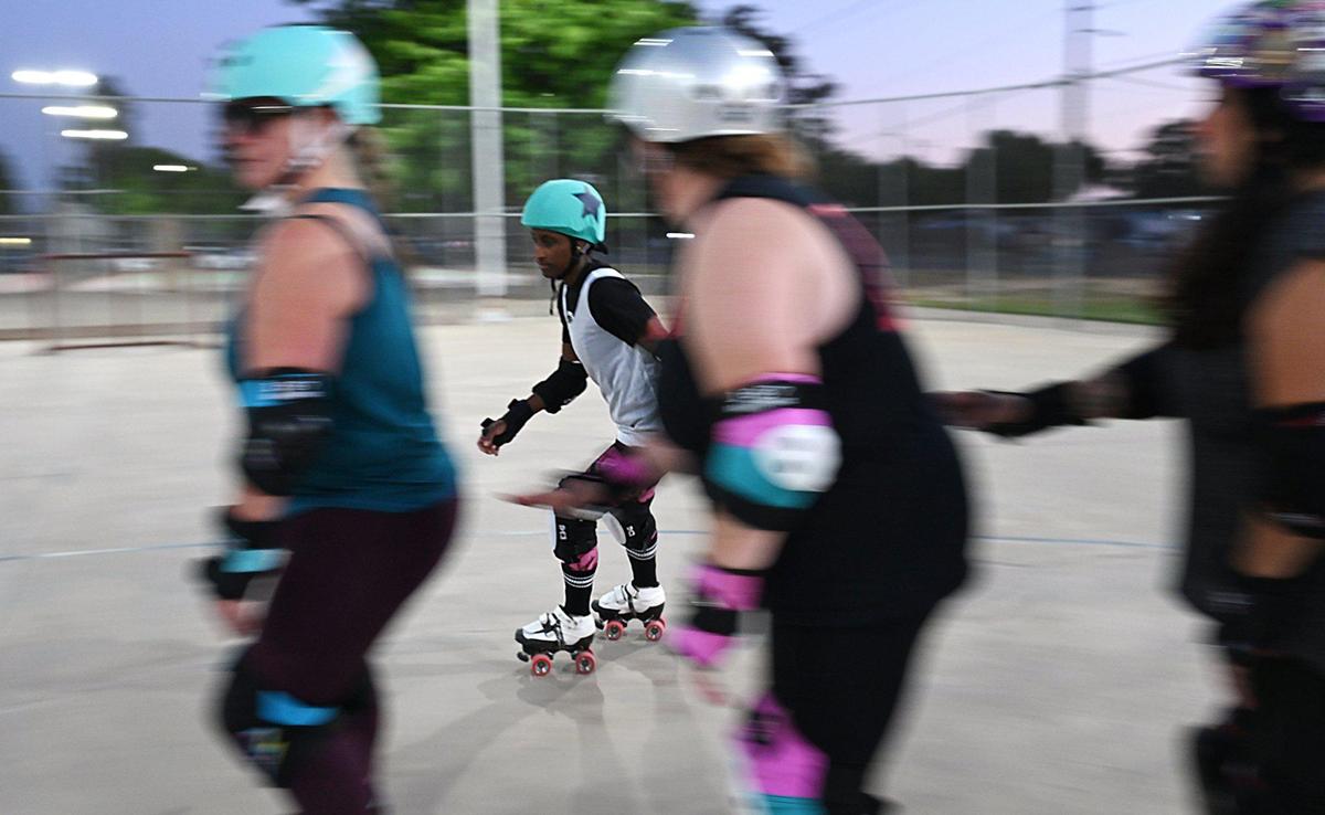 Jammer Erica “Aero” Prandini, background, takes the outside track during Ash City’s practice at Cary Park on Thursday, May 6, 2025, in Fresno, California.