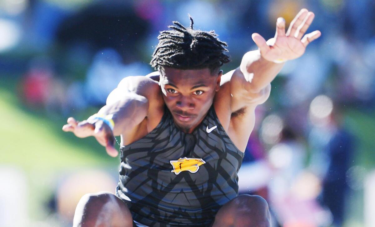Nathan Johnson from Clovis takes his turn in the Boys Long Jump at the CIF State Track and Field Championship finals Saturday, May 28, 2022 in Clovis.