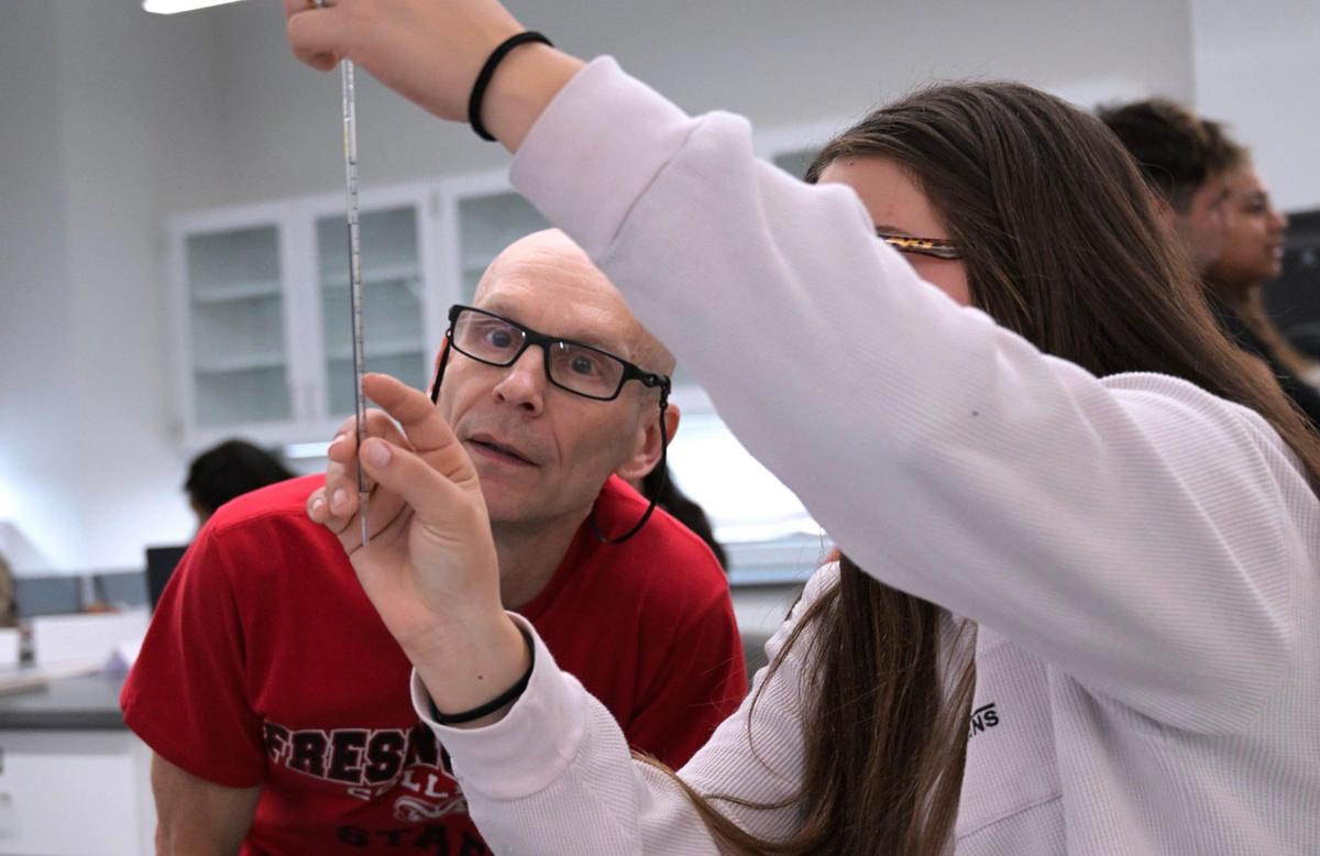 Biology instructor Dr. Mike Gilbert Ph.D. works with a student in the new Science Building at Fresno City College Monday, Jan. 13, 2025 in Fresno.