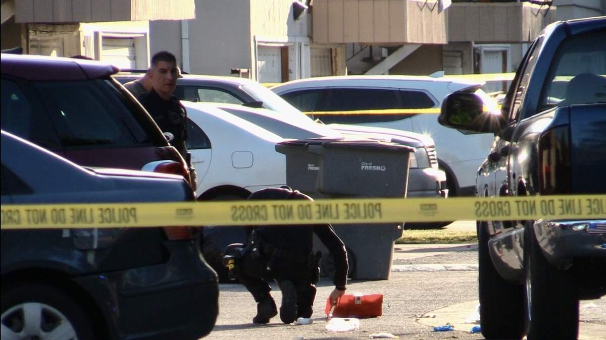 Officers investigate a shooting that left two men injured in Fresno, California on Tuesday, April 30, 2024.