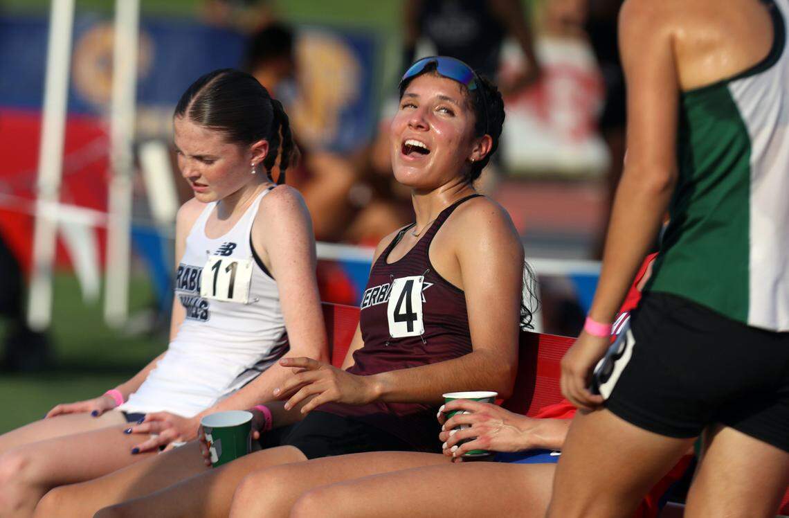 Riverbank High senior Giselle Fernández chats with fellow competitors after finishing sixth in the girls 1,600-meter run in 4:43.8 at the California Scholastic Federation Track and Field Championships at Veterans Memorial Stadium in Clovis on May 31, 2025.