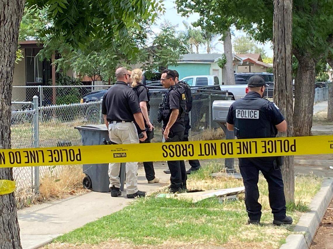Officers investigate the block where two people were shot Thursday, June 8, 2023, in southwest Fresno, police said.