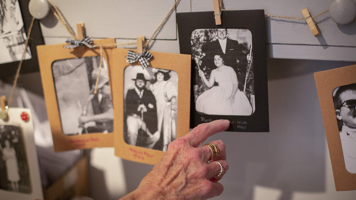 June 24 1961, is the date Susan married her now deceased husband, Harry “Punky” McClellan. The photos were put together by daughter Coreen during the time her father was residing in a nursing home. Susan recently strung the photos together and placed them in her bedroom, “this keeps me sane,” McClellan says. Dec 4, 2021. Photo by Julie Leopo for CalMatters