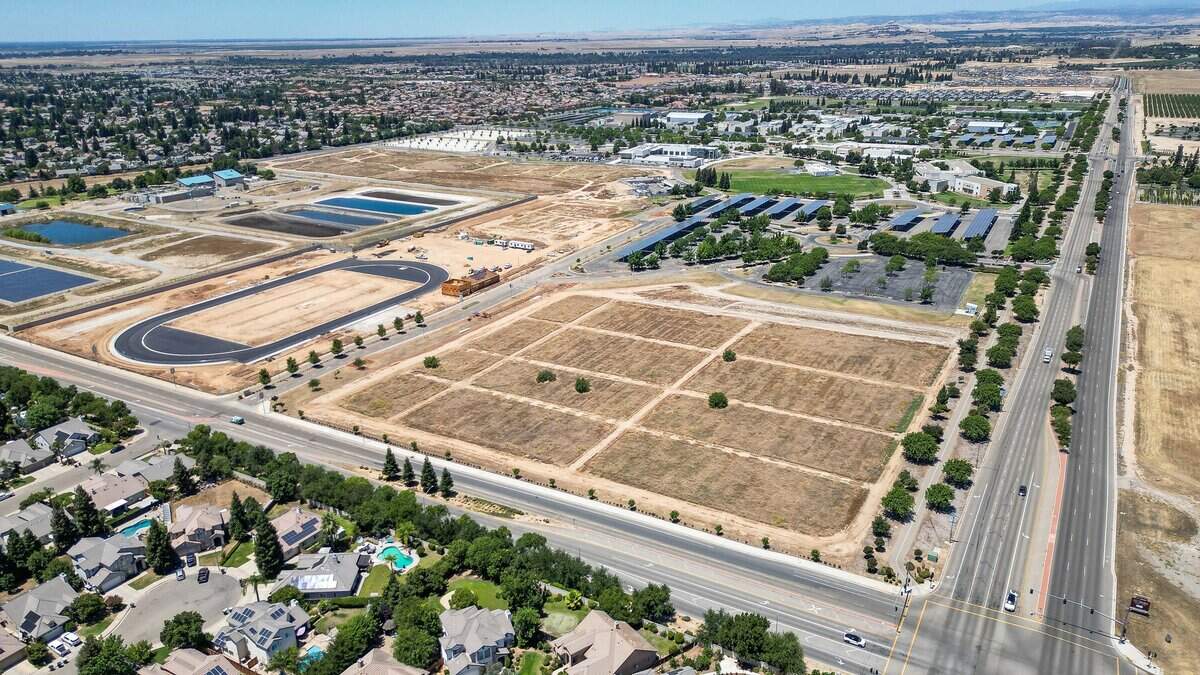 The northeast corner of Behymer and Willow in north Fresno shows the construction of a new sports complex in what was an empty lot behind the main campus of Clovis Community College on Wednesday, June 10, 2026.