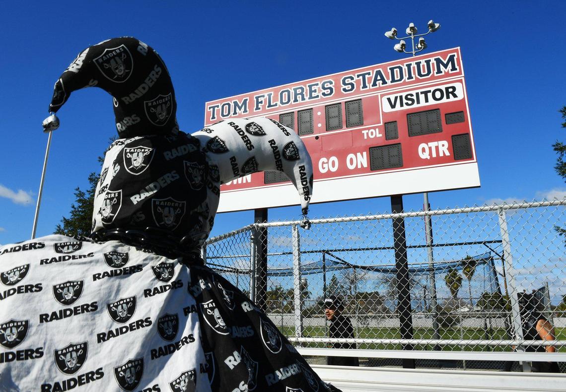 Jester Nation, AKA Travis Foster of Merced, looks up at the scoreboard at Tom Flores Stadium on Saturday, Feb. 20, 2021 in Sanger. Earlier, a large group of fans stood in front of a downtown mural of Flores and greeted him in a Zoom call in celebration of the Raiders coaching legend winning induction into the Pro Football Hall of Fame.