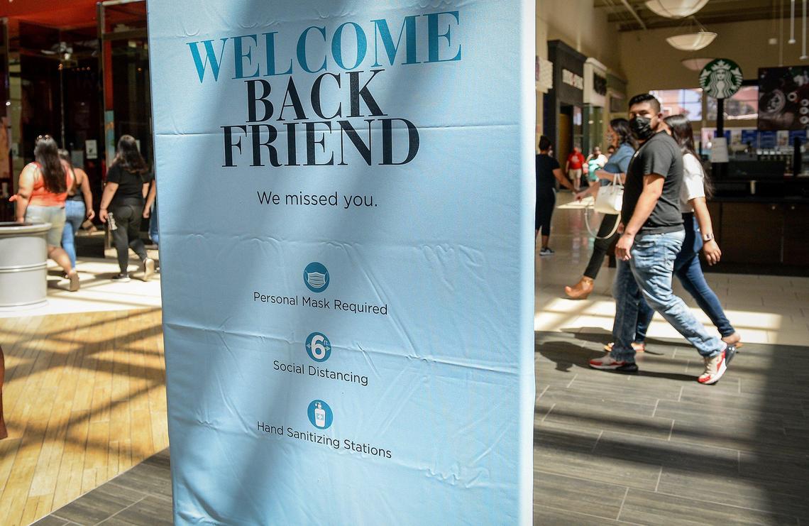 A sign welcoming customers back to Fashion Fair mall displays guidelines for visiting, including wearing masks, maintaining social distancing and using hand sanitizing stations, on Tuesday, May 26, 2020. The mall opened for the first time since late March due to the coronavirus pandemic.