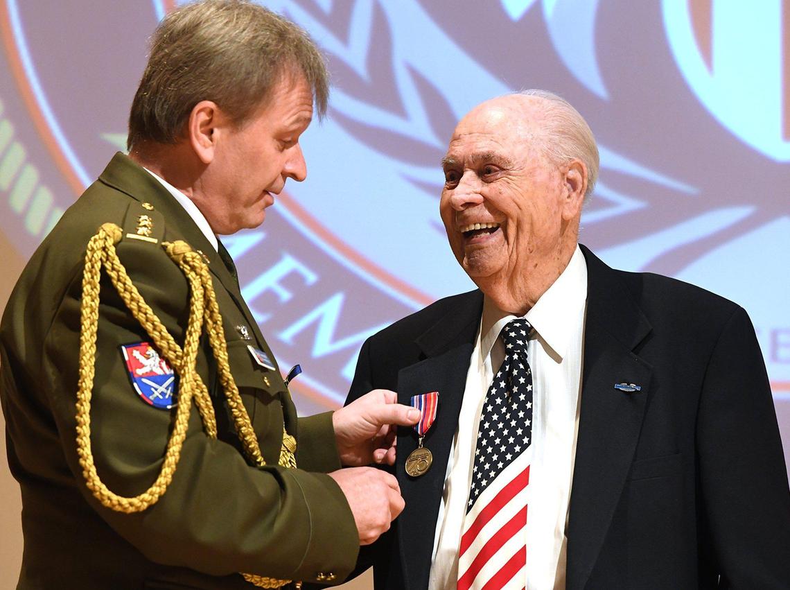 World War II Army veteran Vernon Schmidt, 96, is presented the Honorary Commemorative&nbsp;Medal for his merits in liberating Czechoslovakia in May 1945 and Holocaust survivors from the Flossenburg concentration camp, by Czechoslovakia Army Colonel Jindrich Hacker during a ceremony Thursday March 10, at the Clovis Veterans Memorial District.