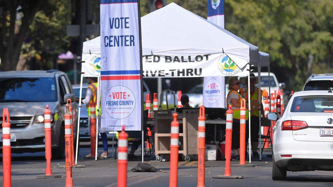 A drop-off service for recall ballots, seen on Kern St. outside the Fresno County Elections Office, receives ballots from cars in both directions Tuesday afternoon, Sept. 14, 2021 in downtown Fresno.