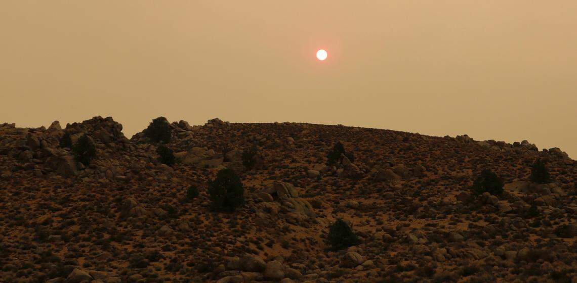 An orange sky hangs over the Buttermilks above Bishop on Sept. 6, 2020. Taylor Stanton said the Eastern Sierra had been “crystal clear” just 24 hours earlier. The Creek Fire changed that.