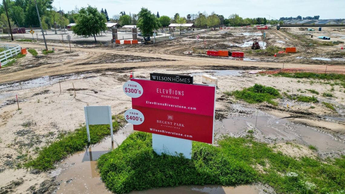 Wilson Homes are advertised on a billboard at the intersection of Sunnyside and Shepherd near the Dry Creek trailhead in Clovis on Wednesday, April 17, 2024. The roads in that area have been closed since Jan. 1 for road widening and underground utilities work related to housing construction in the Heritage Grove growth area. Now city officials say it won’t reopen until the end of June.