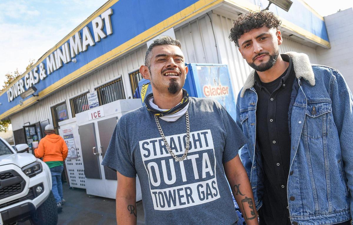 Akram Mohsin, right, who works at his family’s gas station, Tower Gas & Mini Mart, stands with Gilbert Aguilera outside the gas station on Thursday, Nov. 12, 2020. Mohsin captured Aguilera’s story on video which was shared on social media. Aguilera was encouraged to stop drinking and turn his life around.