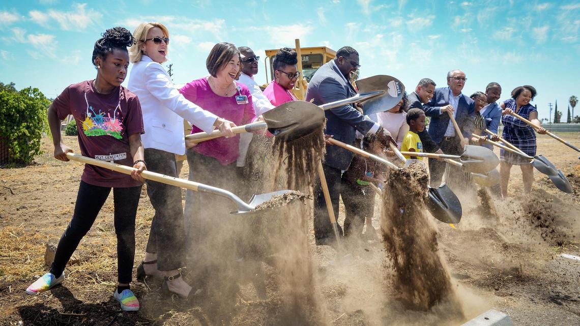 Community leaders, VIP’s, supporters, church members and friends help break ground on the first phase of a community center and park at Saint Rest Baptist Church in southwest Fresno on Tuesday, June 25, 2019. Despite the failure of Measure P to fund city parks in Fresno, the church economic development corporation was able to push forward on funding and grants to get a green space for neighborhood families.