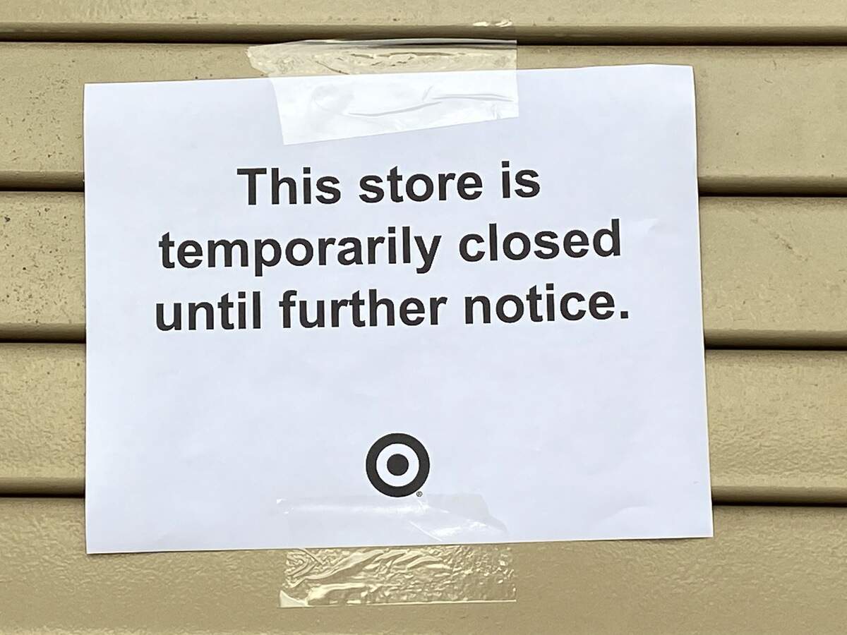 A sign announces the closure of a Fresno Target store.