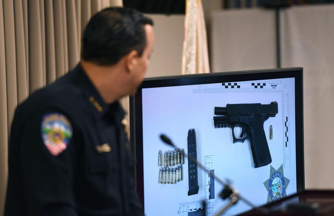 Clovis Chief of Police Curt Fleming shows a weapon confiscated from a recent OIS during a press conference Tuesday, July 19, 2022.