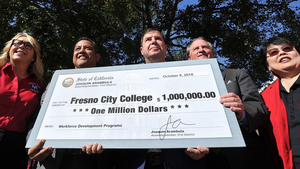 With the $1 million check in state funding for Fresno City College’s Career and Technical Education program presented Tuesday, from left, college president Carole Goldsmith, State Center Community College District trustee Miguel Arias, Assemblyman Joaquin Arambula, State Center board president Bobby Kahn and board vice president Debbie Ikeda.