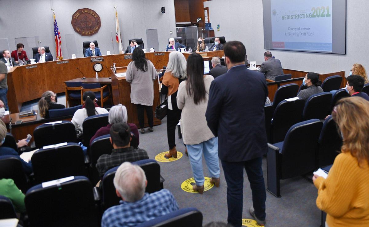 A line forms for public statements as the Fresno County Board of Supervisors held a meeting about redistricting maps Tuesday, Nov. 16, 2021 in Fresno.