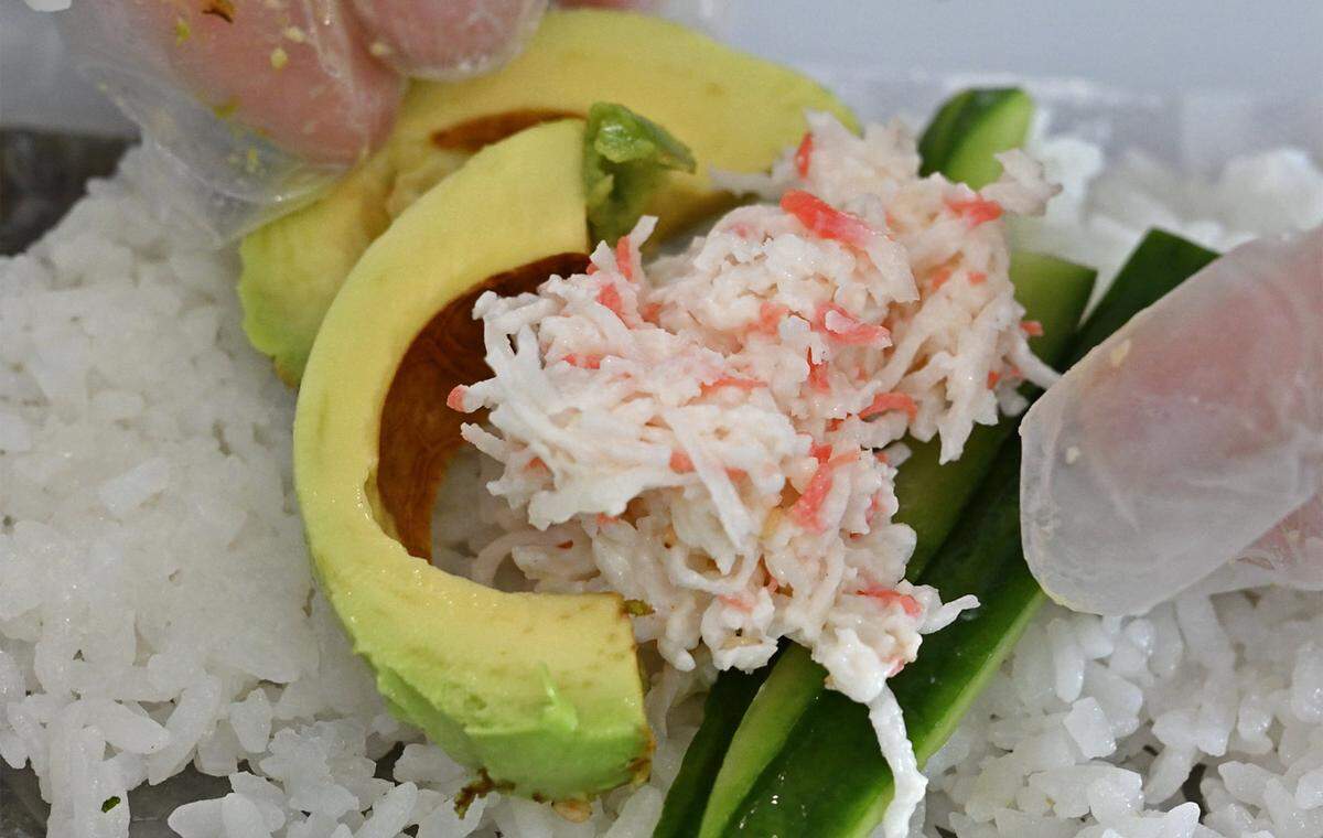 A handroll with Krab is created at the new Poke House located at The Avenue at Heritage Grove, Wednesday, May 20, 2026 in Clovis. 