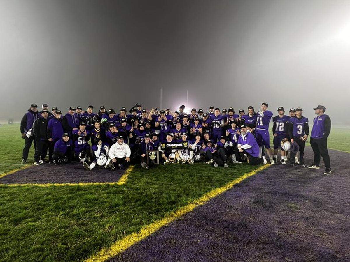 Minarets takes a team photo after a Central Section Division VI title on Friday, Nov. 28, 2025.