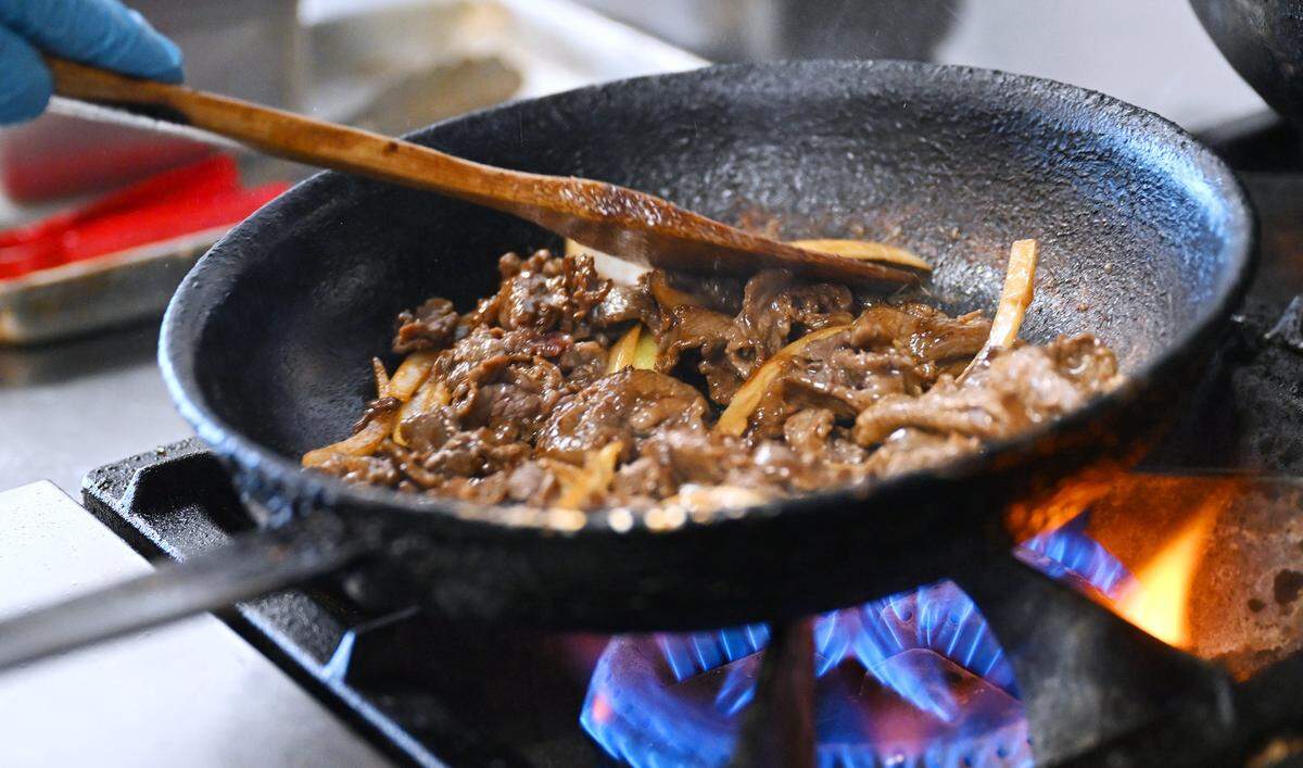 Beef is stir fried at Mai Thao's new fast-casual restaurant Thursday, May 7, 2026 in Clovis.