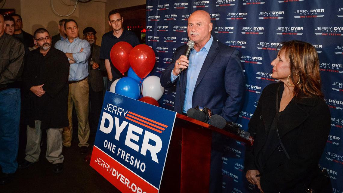 Jerry Dyer stands with his wife Diane while speaking to supporters during an election night party at The Elbow Room in Fresno on Tuesday, March 3, 2020.