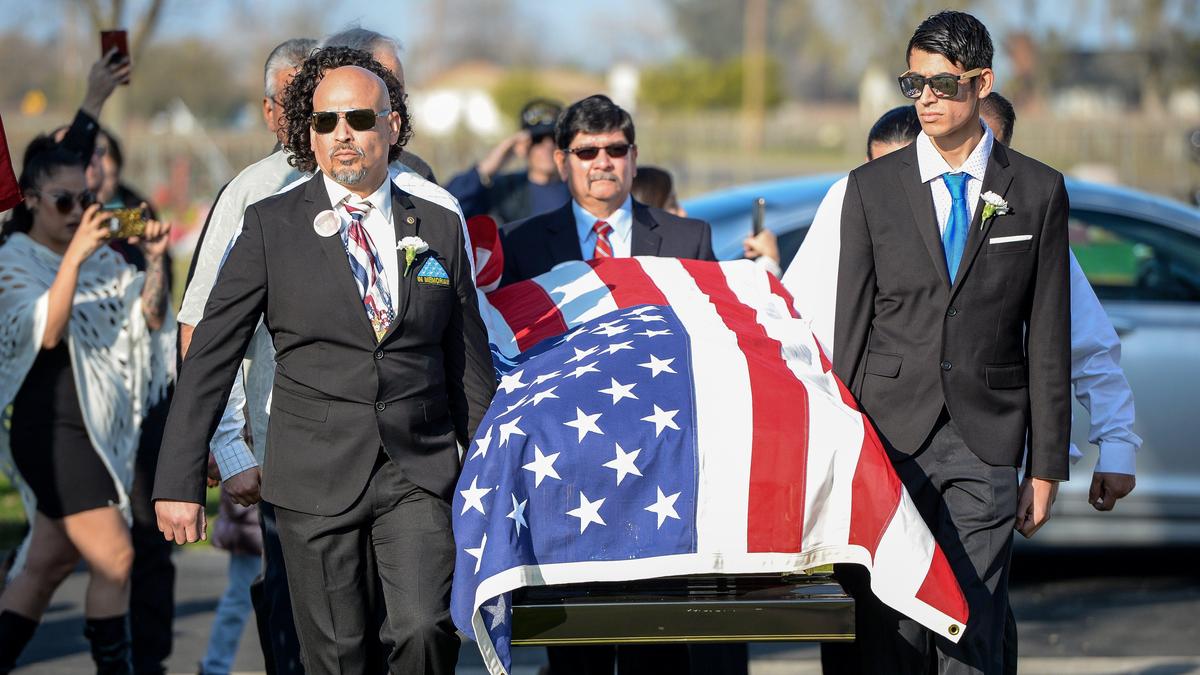 Pallbearers carry the casket of Pasqual Reyes of Madera, a World War II prisoner of war in Germany, during a funeral with military honors at Calvary Cemetery in Madera on Friday, Jan. 10, 2020. He died last month at the age of 96.