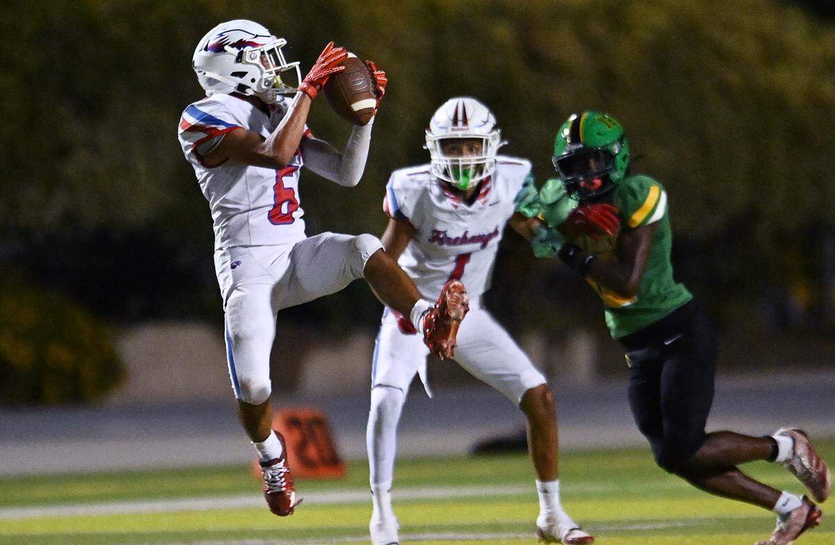 Firebaugh's Julian Garcia catches a pass against Roosevelt at Sunnyside's stadium Friday, Sept. 12, 2025 in Fresno. The Rough Riders pummeled the Eagles 46-6 with Firebaugh scoring their only touchdown in the final minutes of the game.