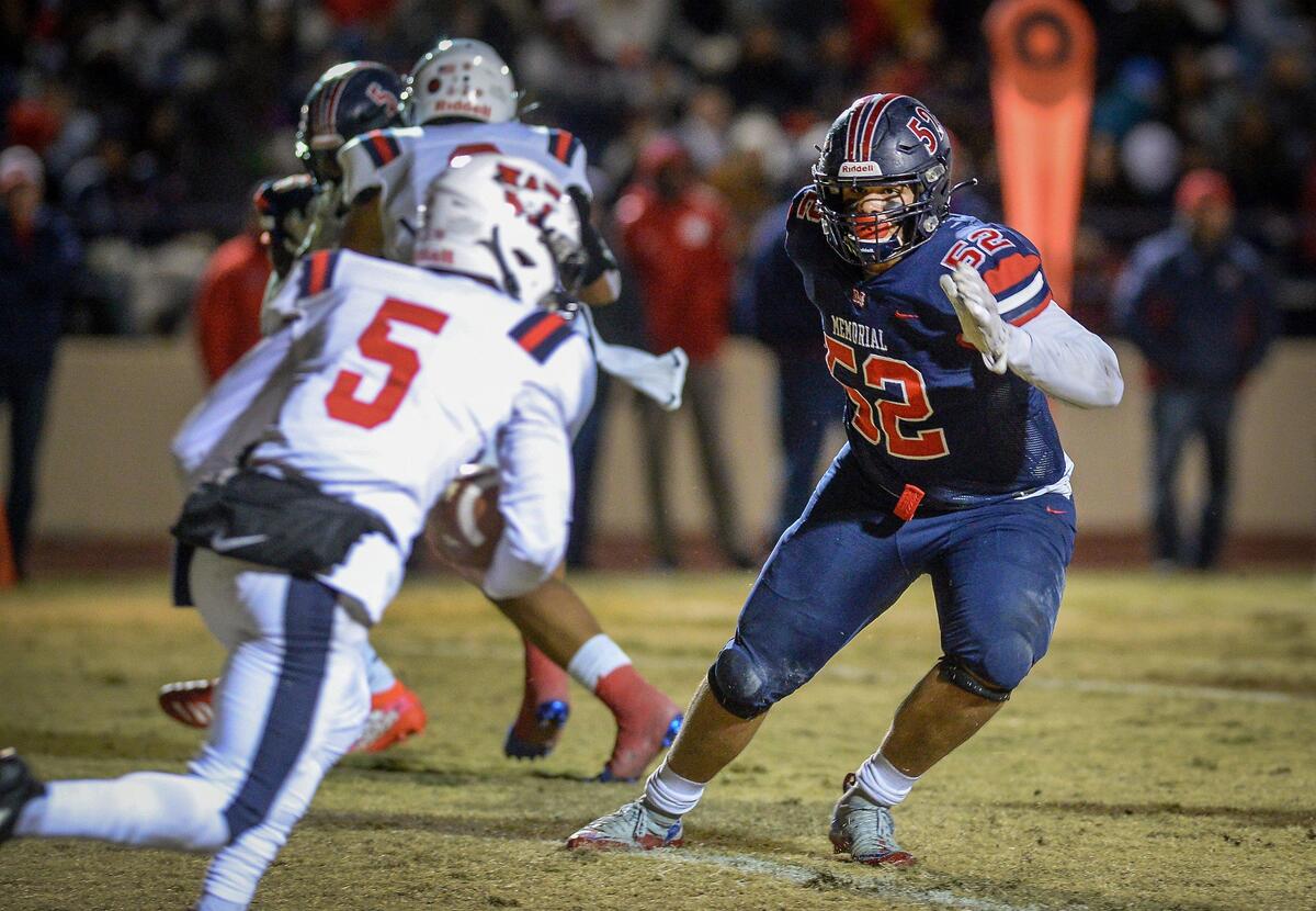 San Joaquin Memorial’s Tobin Phillips looks to tackle Tulare Western’s Mikey Ficher during their Division II Central Section championship football game at San Joaquin Memorial on Friday, Nov. 29, 2019.