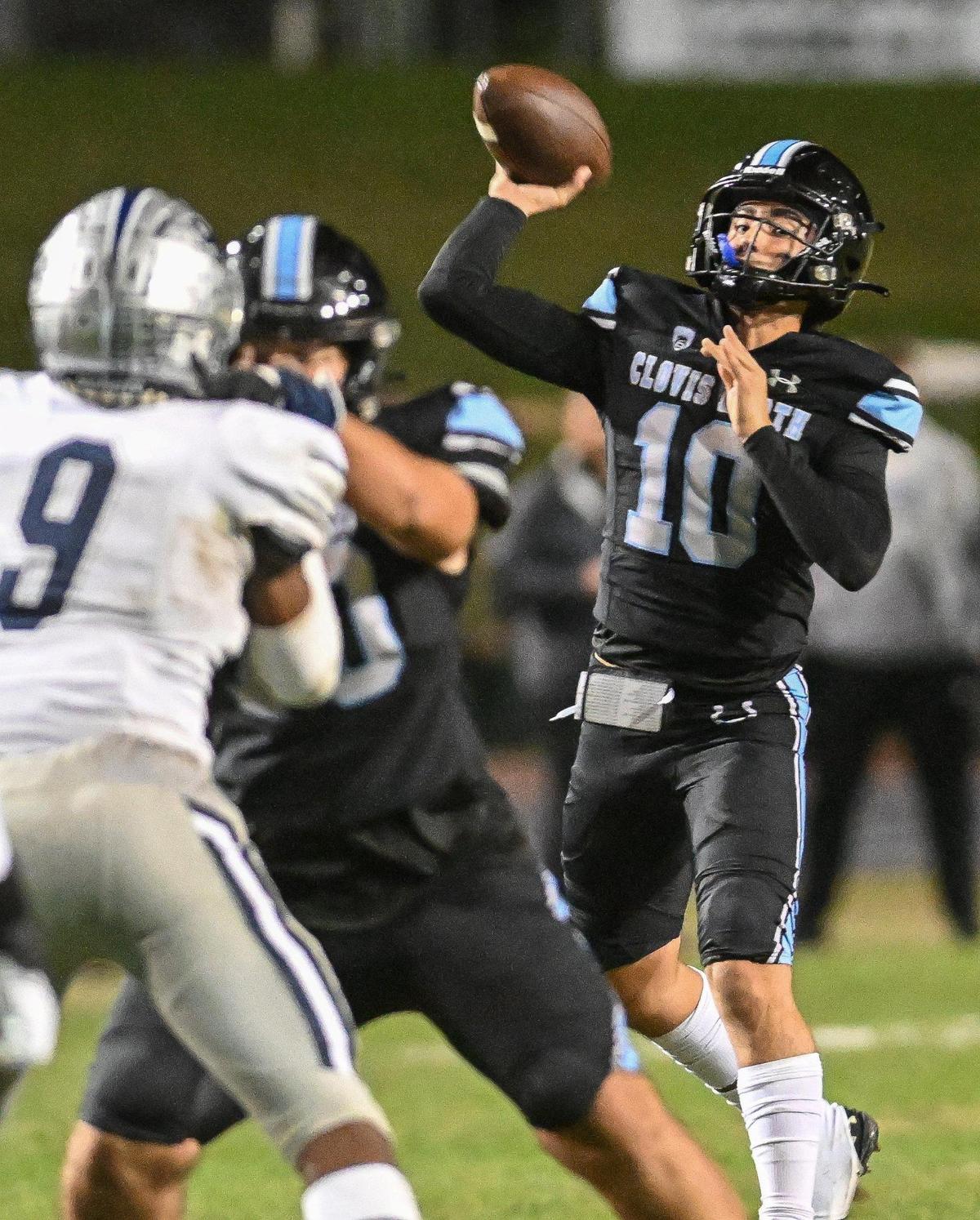 Clovis North quarterback Mario Cosma throws for a touchdown against Clovis East in their Central Section Division I semifinal at Veterans Memorial Stadium on Friday, Nov. 17, 2023.