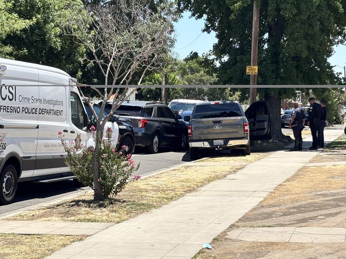A stolen Kia was boxed in by authorities after a disturbance at a taco shop at Hazelwood Boulevard and Ventura Street in Fresno, California on Monday, July 6, 2026. Four people were taken into custody.